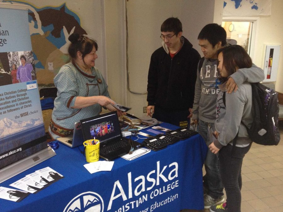 Liz Chase, left, talks with several Galena students visiting her recruiting booth in the composite building commons area.