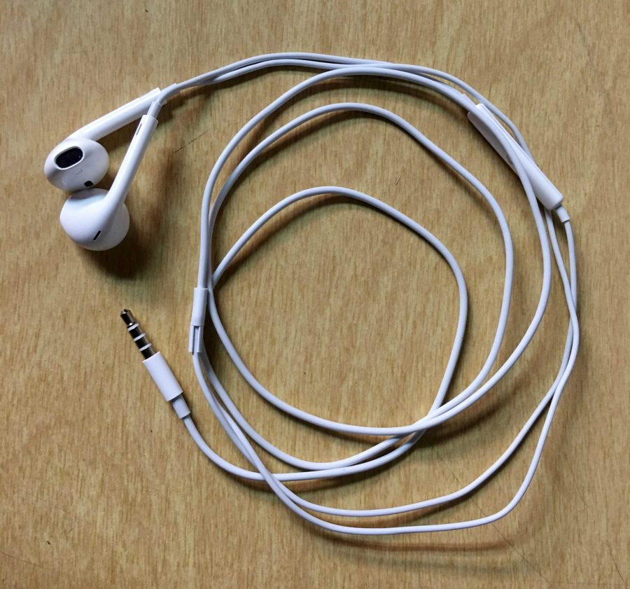 Earbuds, such as these from an iPhone 6, were banned completely from all classes on Friday, causing consternation among some students and staff.