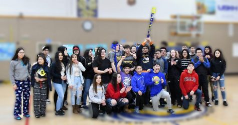 The prize of prizes, the Galena Spirit Stick, is shown here in the hands of the class of 2020, who won the stick during a pep rally in March 2019. 					